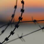silhouette of barbwire during sunset