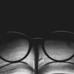 photo of eyeglasses on book page